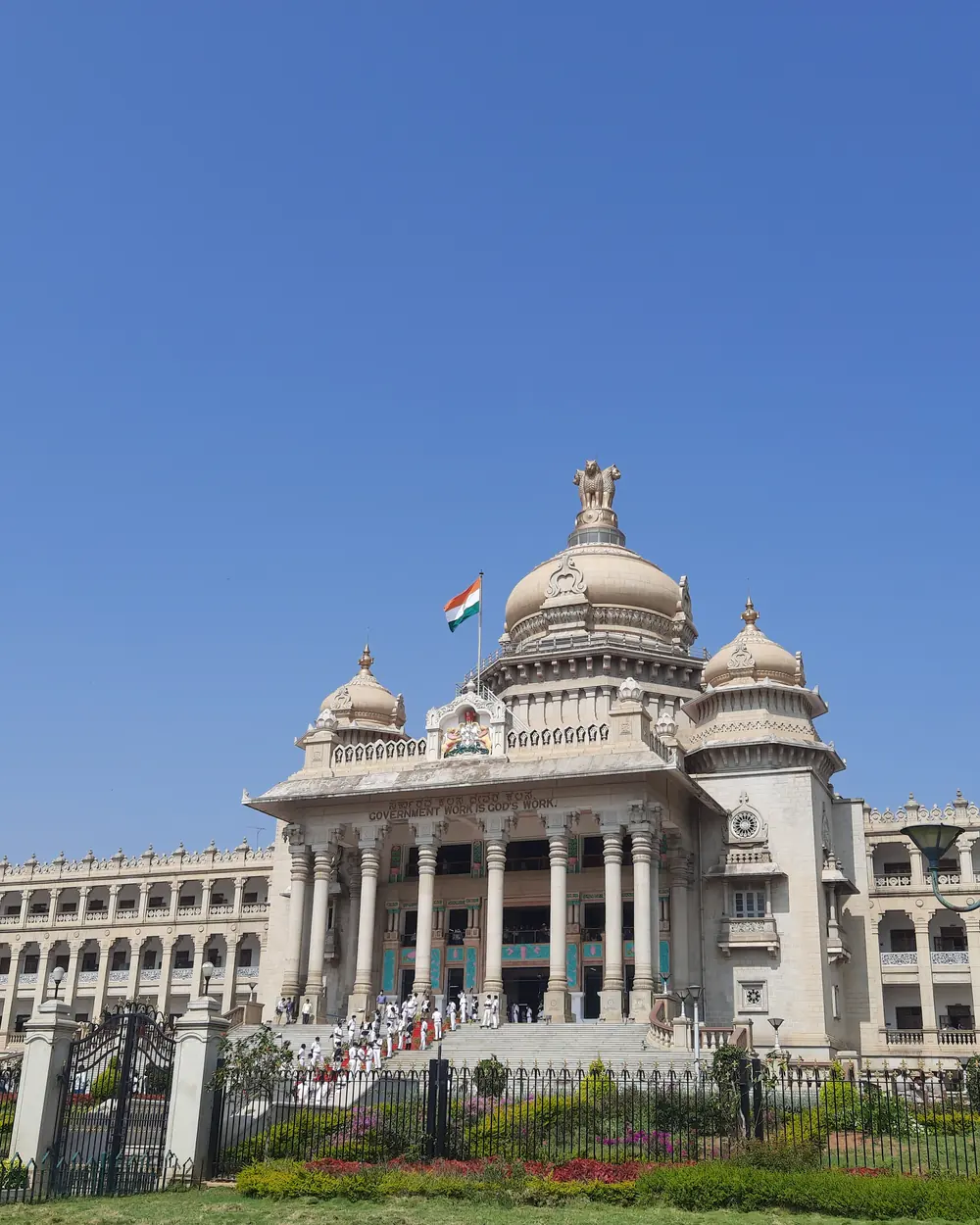 Vidhana Soudha beneath a clear blue sky in Bengaluru